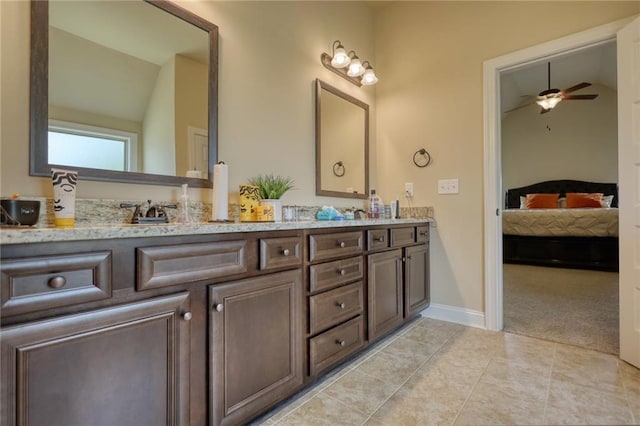 200 Baumgard, Locust Grove, GA 30248 - ensuite bathroom with vaulted ceiling, double vanity, ceiling fan, and tile patterned floors