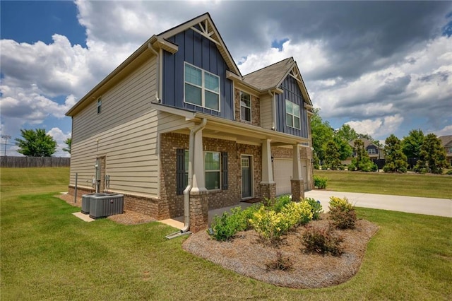 200 Baumgard, Locust Grove, GA 30248 - view of side of home with board and batten siding, concrete driveway, an attached garage, and a lawn