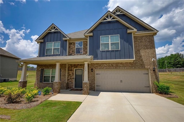 200 Baumgard, Locust Grove, GA 30248 - craftsman-style home with board and batten siding, an attached garage, concrete driveway, a front lawn, and brick siding