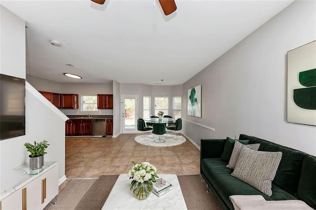 living room featuring sink and ceiling fan