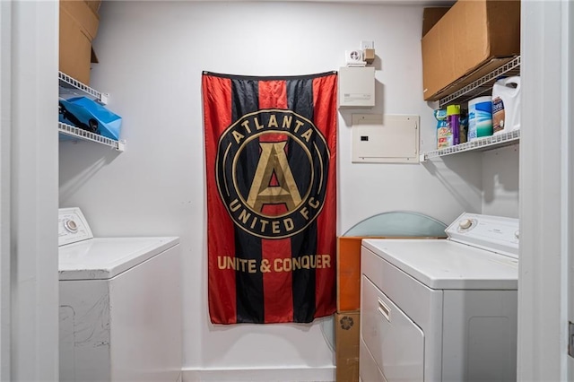 clothes washing area featuring washer and clothes dryer