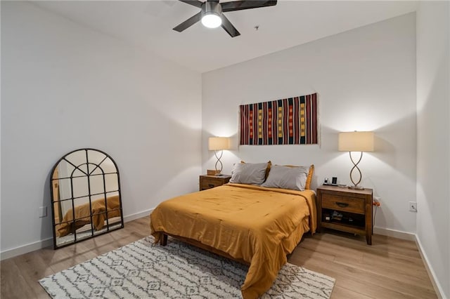 bedroom featuring light hardwood / wood-style flooring and ceiling fan