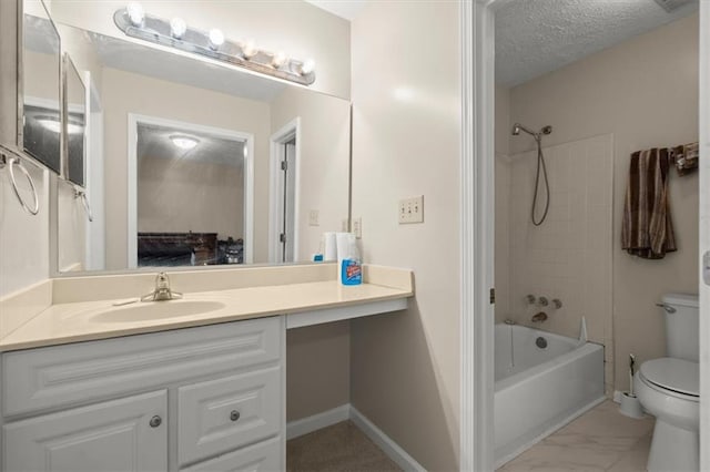 full bathroom with vanity, a textured ceiling, toilet, and tiled shower / bath combo