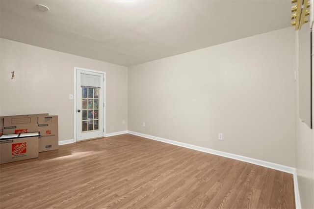 spare room featuring light hardwood / wood-style floors