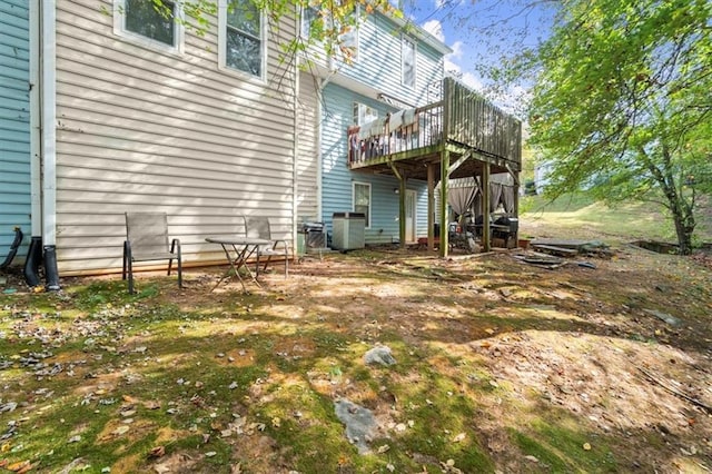 view of yard featuring a deck and cooling unit