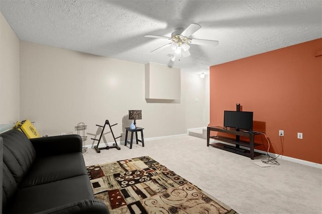 carpeted living room featuring a textured ceiling and ceiling fan