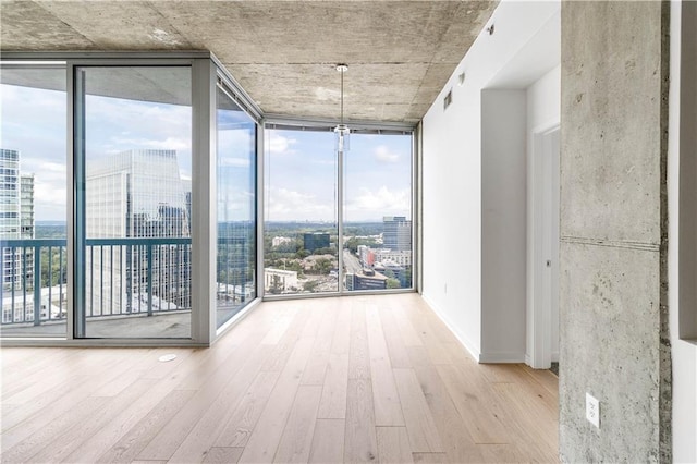 3324 Peachtree Rd NE Unit 2518, Atlanta, GA 30326 - hall featuring expansive windows, a view of city, and wood finished floors