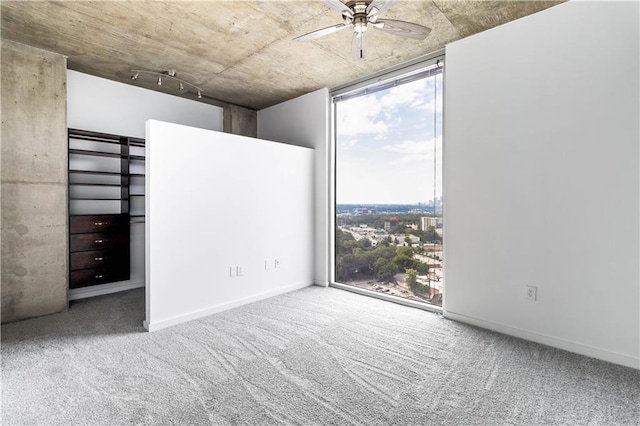 3324 Peachtree Rd NE Unit 2518, Atlanta, GA 30326 - spare room with a ceiling fan, plenty of natural light, floor to ceiling windows, and carpet