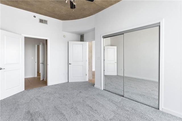 3324 Peachtree Rd NE Unit 2518, Atlanta, GA 30326 - unfurnished bedroom featuring carpet floors, a closet, and ceiling fan