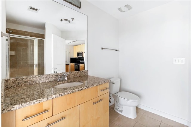 3324 Peachtree Rd NE Unit 2518, Atlanta, GA 30326 - full bath with vanity, a stall shower, and tile patterned flooring