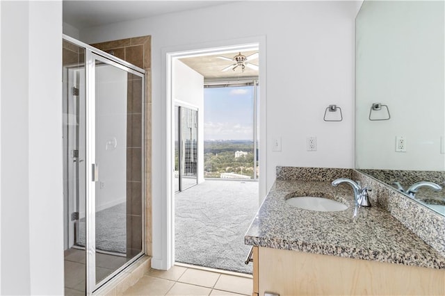 3324 Peachtree Rd NE Unit 2518, Atlanta, GA 30326 - bathroom with vanity, a shower stall, tile patterned flooring, and ceiling fan