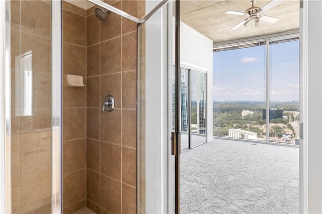3324 Peachtree Rd NE Unit 2518, Atlanta, GA 30326 - bathroom featuring a shower stall, ceiling fan, plenty of natural light, and expansive windows