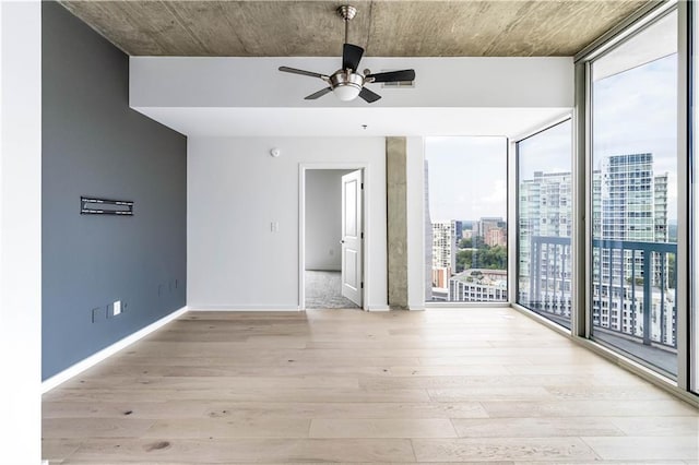 3324 Peachtree Rd NE Unit 2518, Atlanta, GA 30326 - unfurnished room with a ceiling fan, light wood finished floors, floor to ceiling windows, and a city view