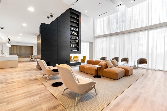 3324 Peachtree Rd NE Unit 2518, Atlanta, GA 30326 - common area with a towering ceiling, a wall of windows, and a surveillance system