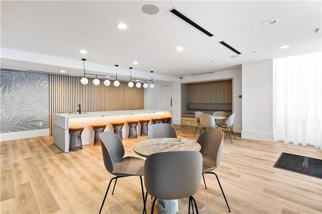 3324 Peachtree Rd NE Unit 2518, Atlanta, GA 30326 - dining room featuring wet bar, light wood-type flooring, recessed lighting, and wallpapered walls