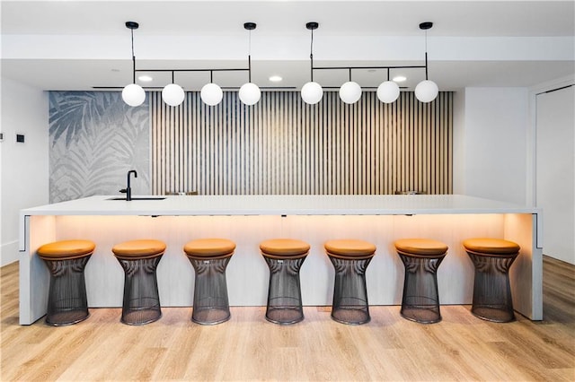 3324 Peachtree Rd NE Unit 2518, Atlanta, GA 30326 - bar with wood finished floors and decorative light fixtures