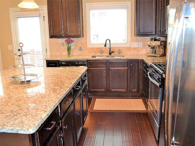1035 Willow Field Ln SE, Marietta, GA 30067 - kitchen with a wealth of natural light, appliances with stainless steel finishes, tasteful backsplash, and a sink