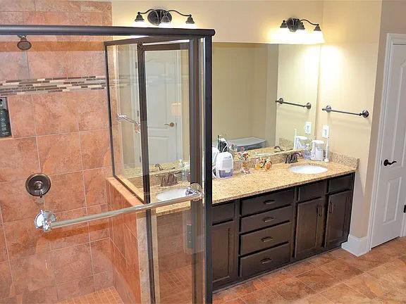 1035 Willow Field Ln SE, Marietta, GA 30067 - full bath featuring a shower stall and vanity