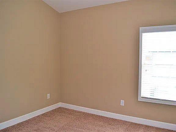 1035 Willow Field Ln SE, Marietta, GA 30067 - unfurnished room with baseboards and light carpet
