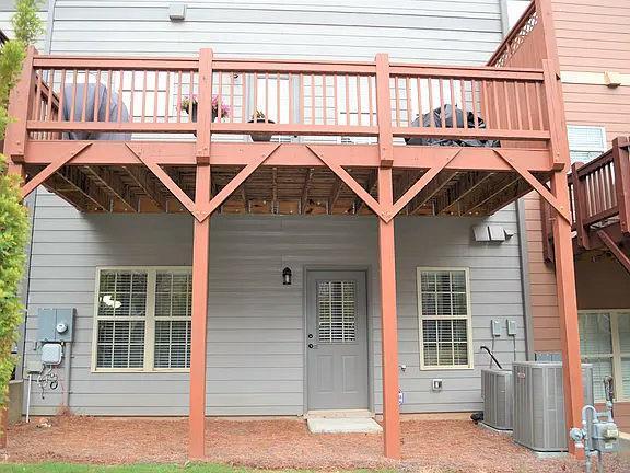 1035 Willow Field Ln SE, Marietta, GA 30067 - doorway to property featuring central AC and a wooden deck