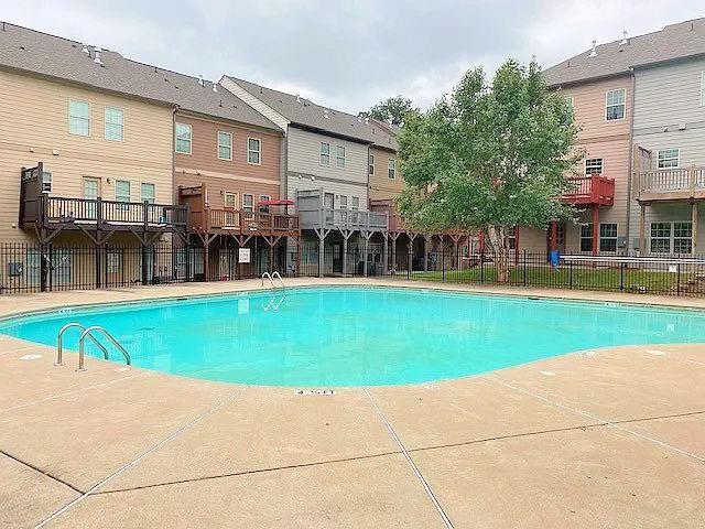 1035 Willow Field Ln SE, Marietta, GA 30067 - pool featuring a patio area, fence, and a residential view