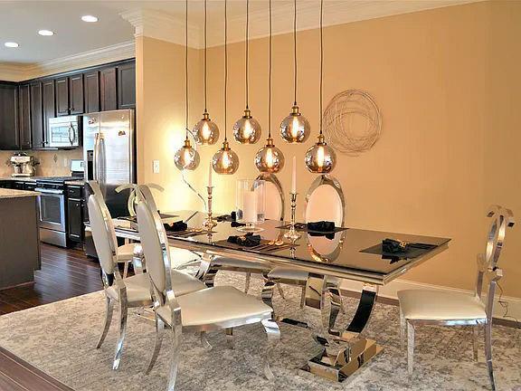 1035 Willow Field Ln SE, Marietta, GA 30067 - dining area featuring baseboards, recessed lighting, ornamental molding, and dark wood finished floors