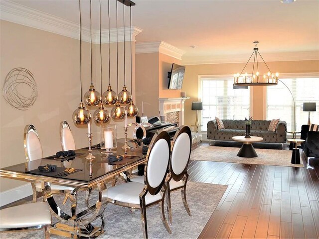 1035 Willow Field Ln SE, Marietta, GA 30067 - dining area featuring wood-type flooring, ornamental molding, and a notable chandelier