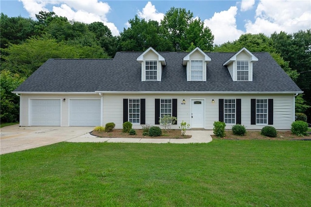 new england style home with a front lawn and a garage