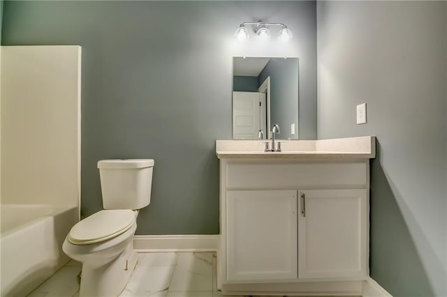 bathroom with tile patterned flooring, vanity, and toilet