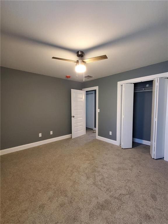 unfurnished bedroom featuring carpet and ceiling fan