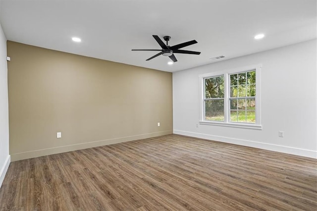 unfurnished room with visible vents, baseboards, ceiling fan, wood finished floors, and recessed lighting