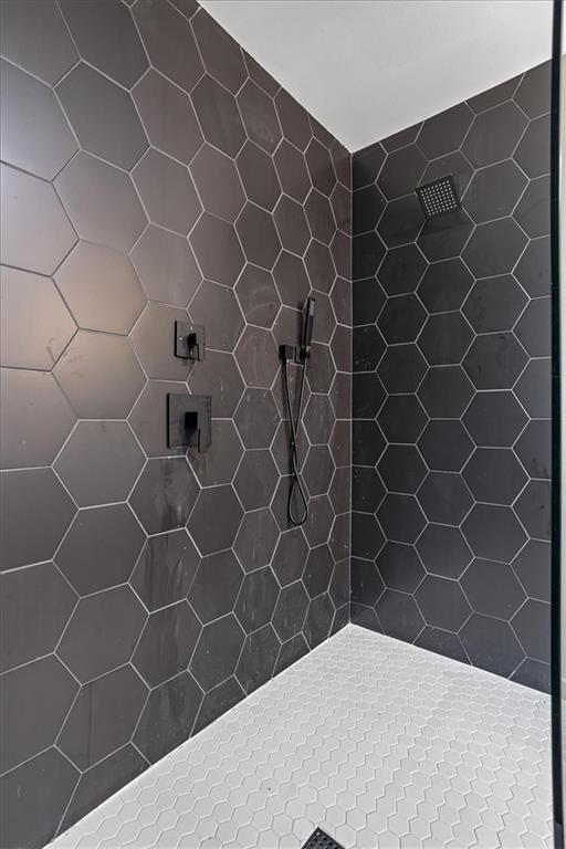 interior space featuring tiled shower