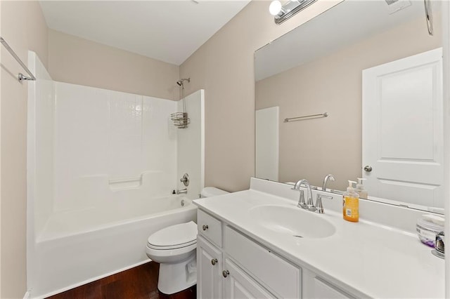 full bathroom with shower / tub combination, wood-type flooring, vanity, and toilet