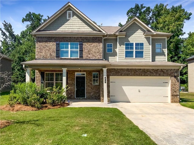 craftsman house with a garage, a front yard, and covered porch