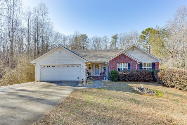 ranch-style house with a garage and a front lawn