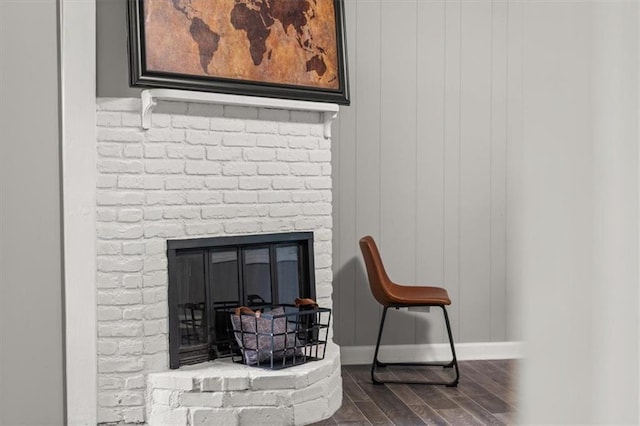 room details featuring wood-type flooring and a fireplace