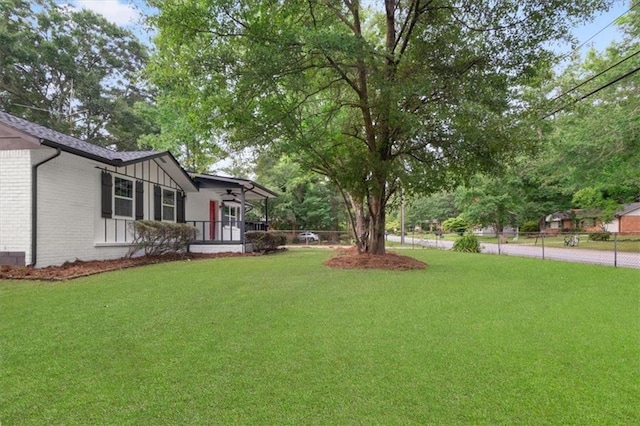 view of yard with covered porch