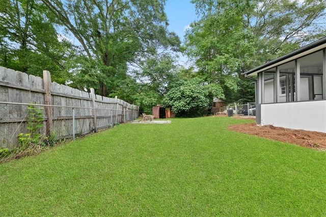 view of yard featuring a sunroom