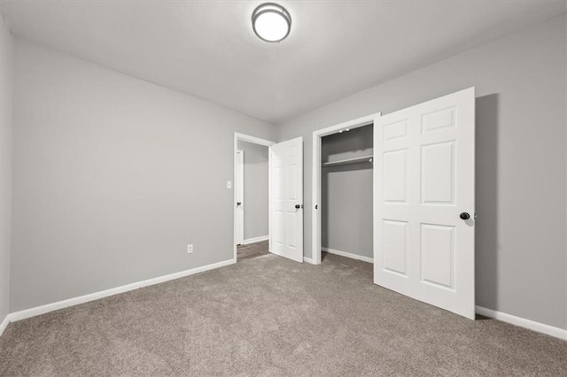 unfurnished bedroom with carpet and a closet