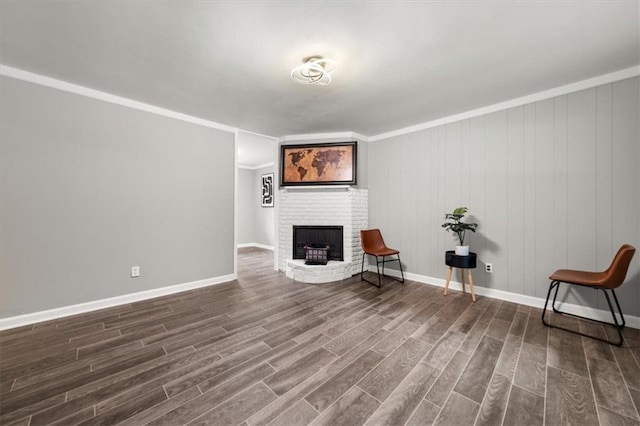 unfurnished room with a fireplace, hardwood / wood-style floors, wooden walls, and ornamental molding