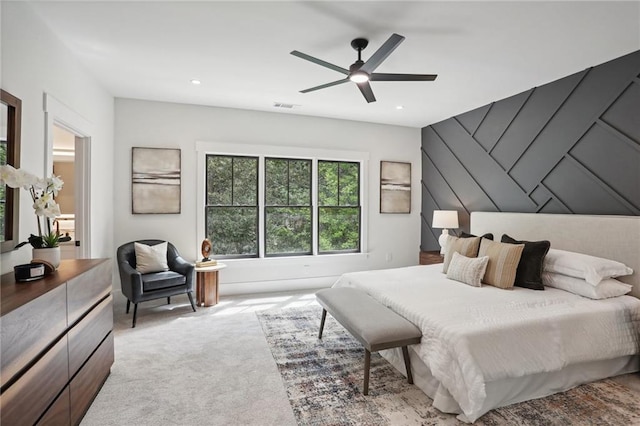 bedroom featuring ceiling fan and light carpet