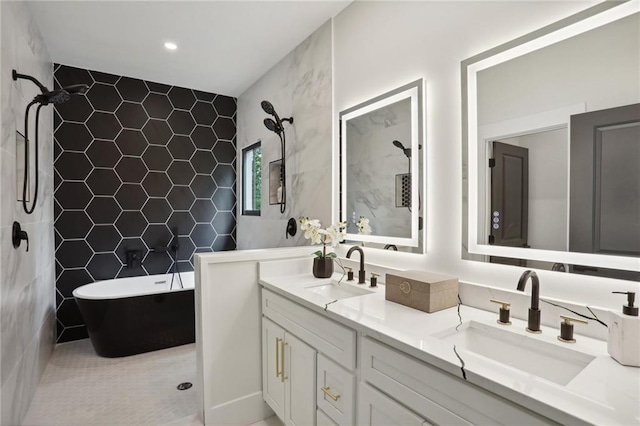 bathroom featuring a washtub, vanity, and tile walls