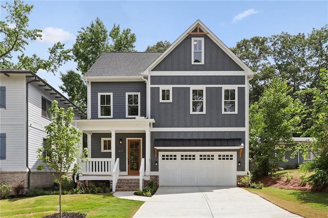 craftsman inspired home featuring a front lawn, a porch, and a garage