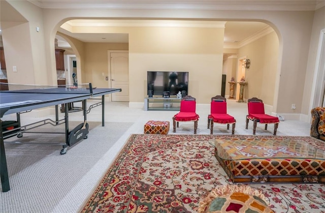 playroom with light carpet and crown molding