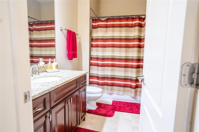 full bathroom with vanity, toilet, and shower / bath combo with shower curtain