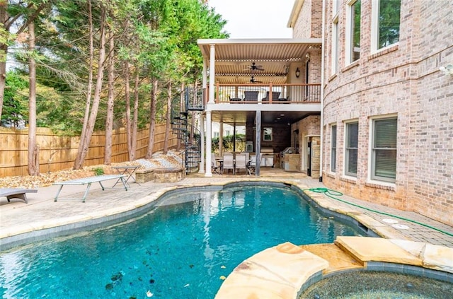 view of pool featuring ceiling fan and a patio area