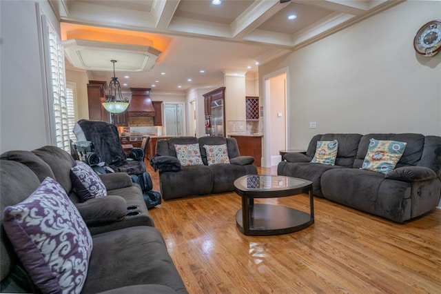 living room with crown molding, beamed ceiling, coffered ceiling, and light wood-type flooring