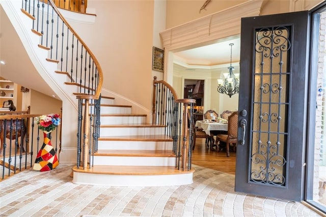 foyer entrance featuring a chandelier and hardwood / wood-style flooring