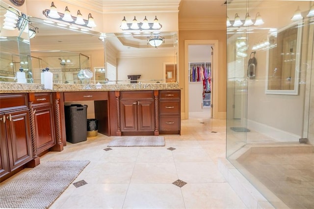 bathroom featuring tile patterned floors, crown molding, a shower with door, and vanity