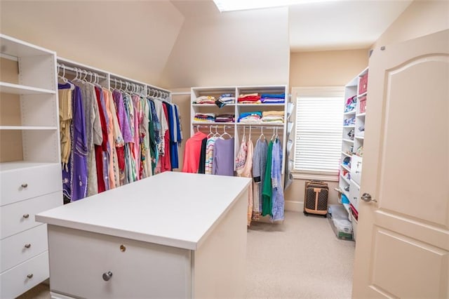 spacious closet with carpet and lofted ceiling